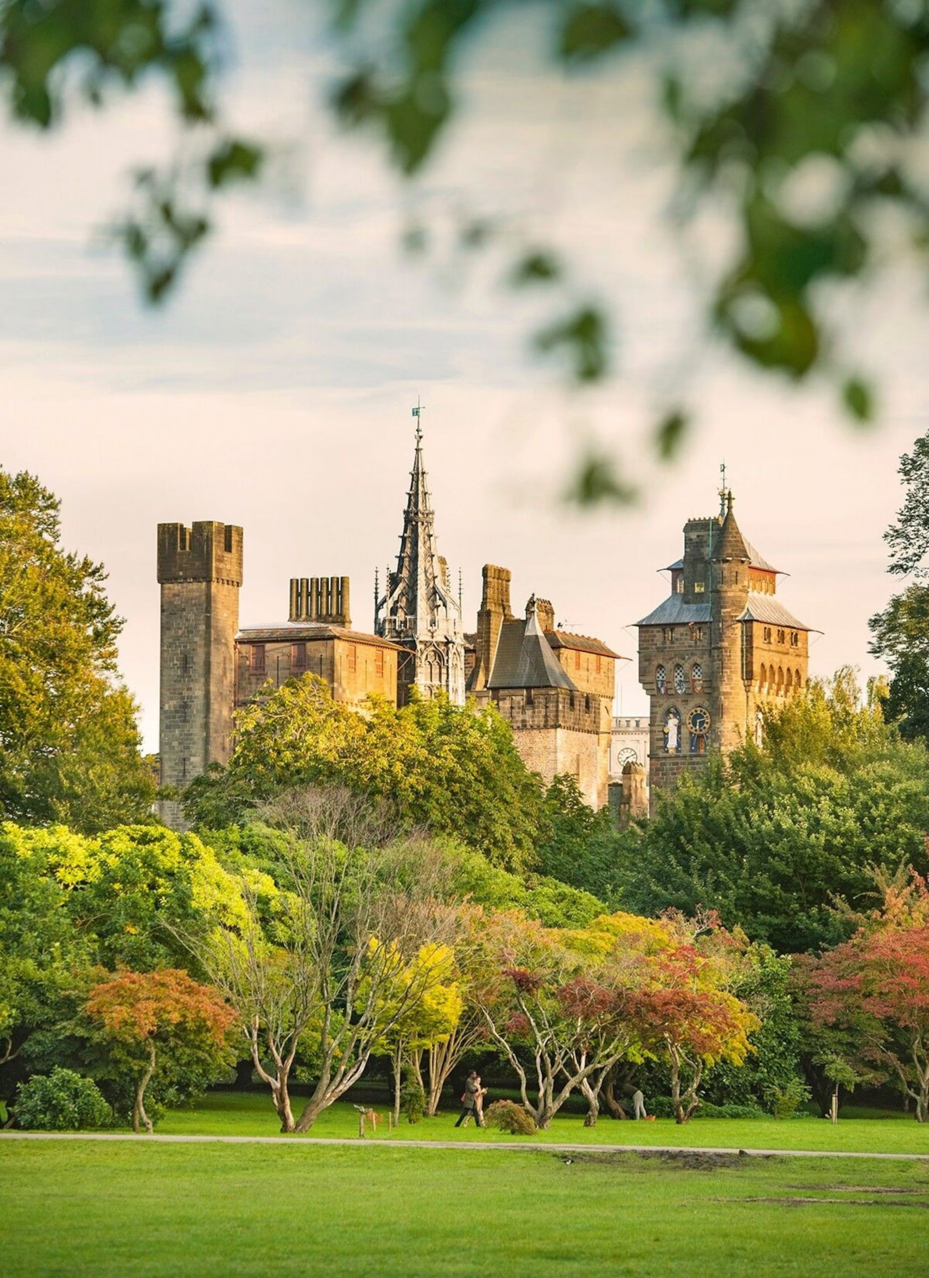 Cardiff Castle towers rising above the autumn trees of Bute Park