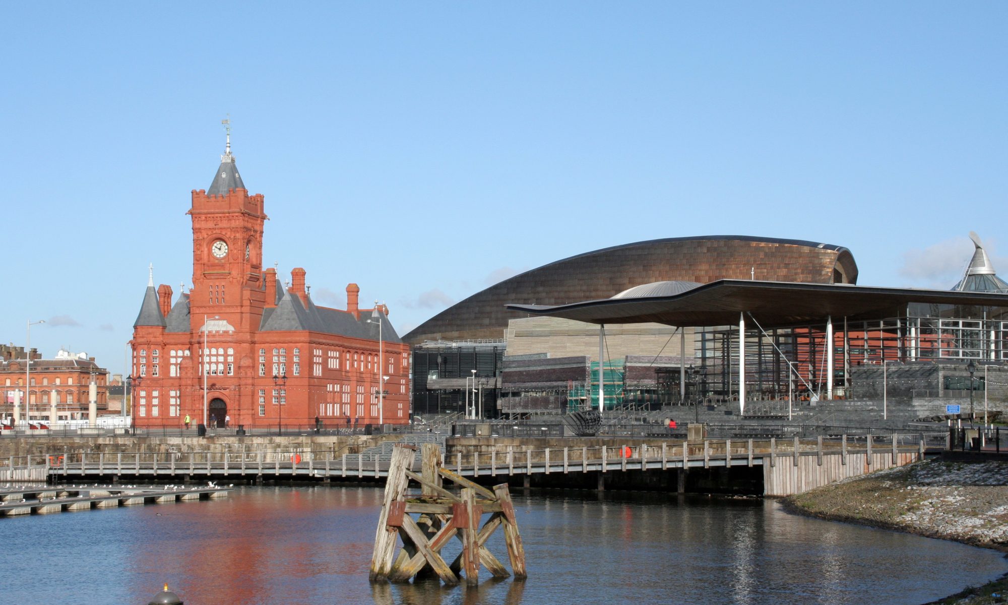 The red-brick Pierhead Building and the Senedd on Cardiff Bay